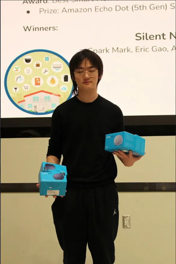 Me at the closing ceremony with our team's winnings.
